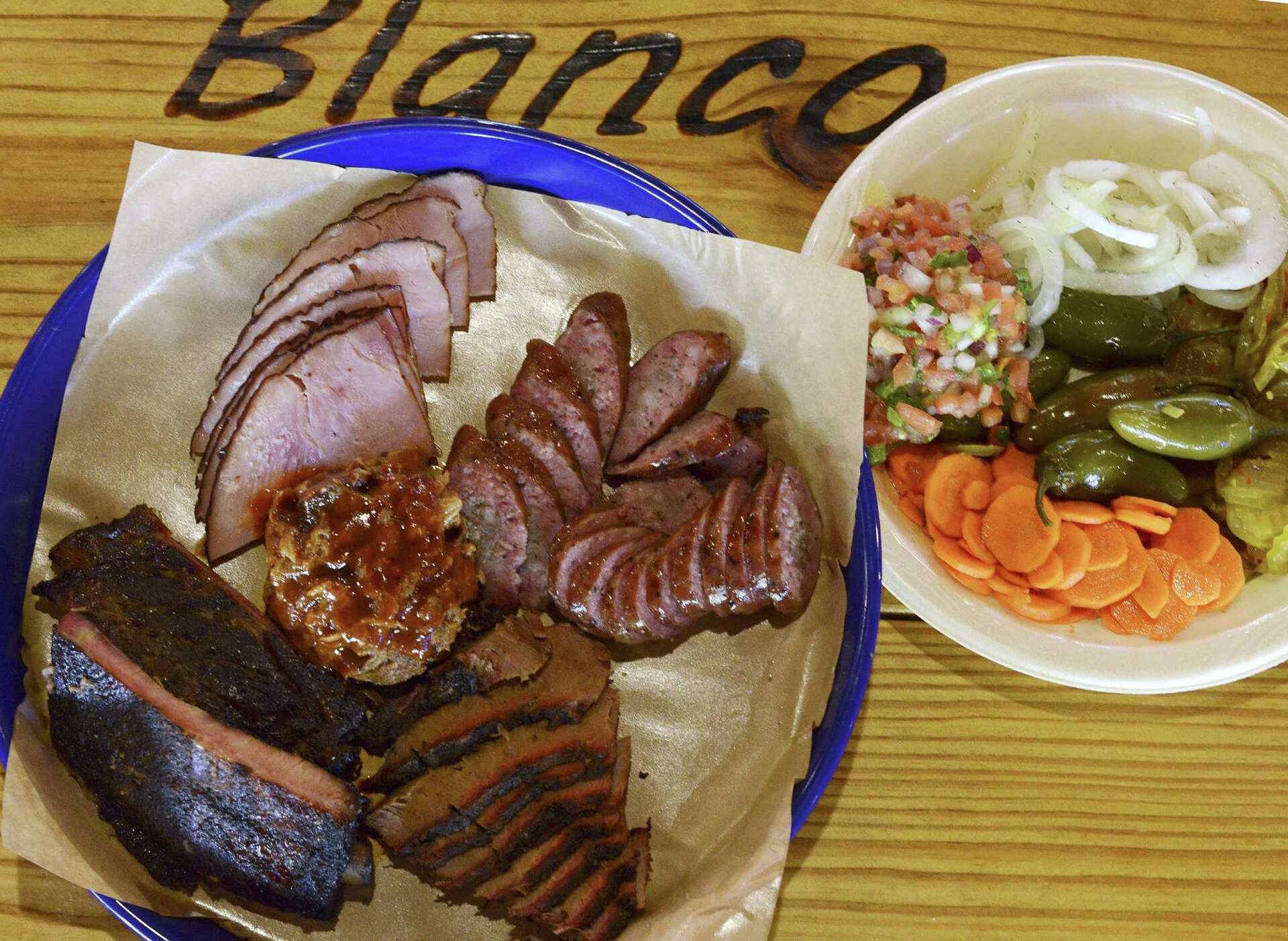 Blanco BBQ signature dishes Brisket Taco, Ribs, Chopped BBQ, Brisket.
